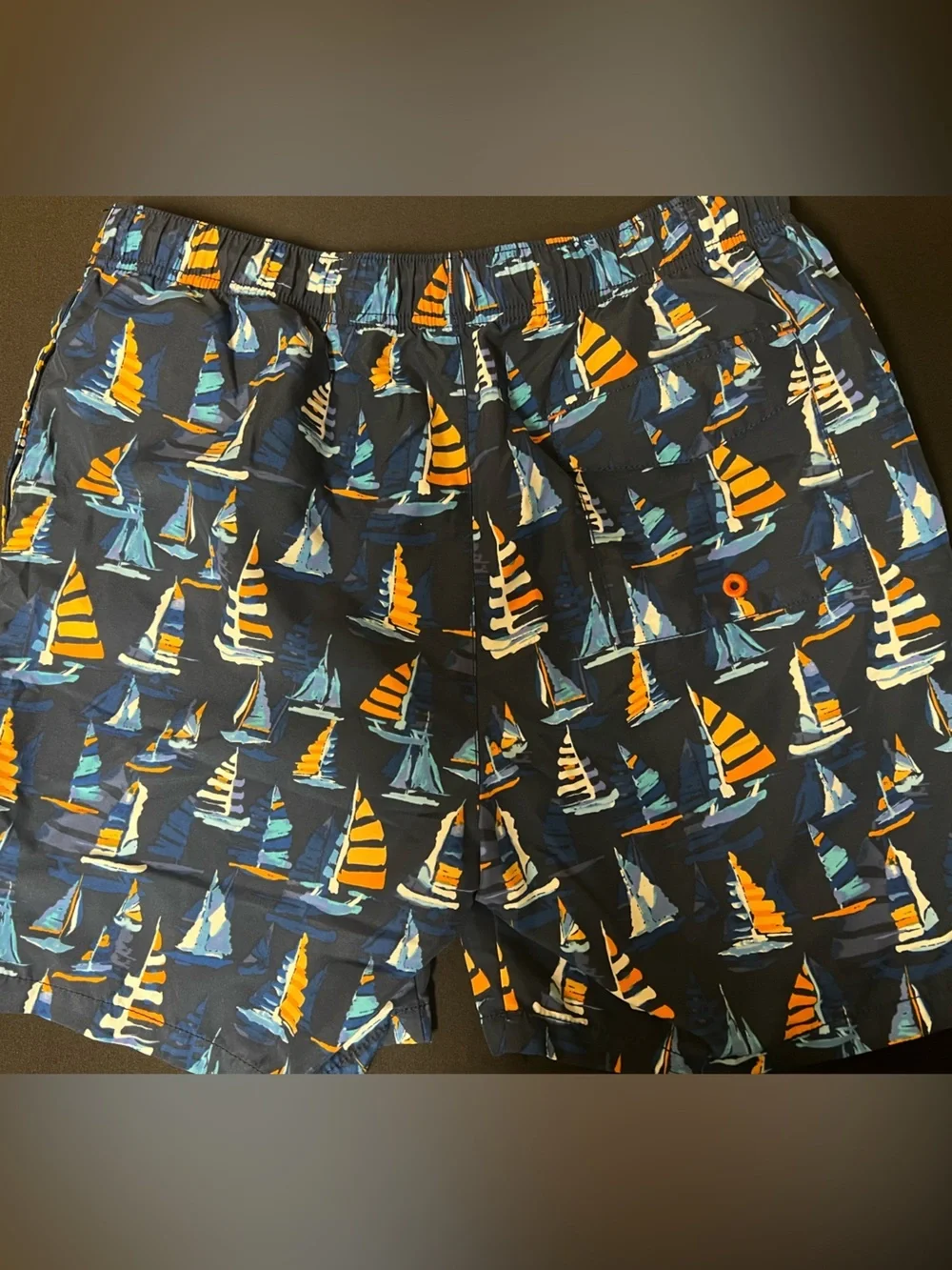 TOMMY BAHAMA RELAX NAVY TRUNKS W/ORANGE/LT BLUE SAILBOAT PRINT. MEDIUM
